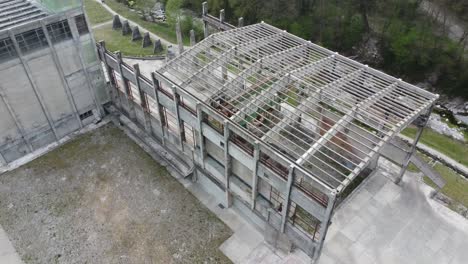 abandoned cement factory monument in the middle of nature drone 4k