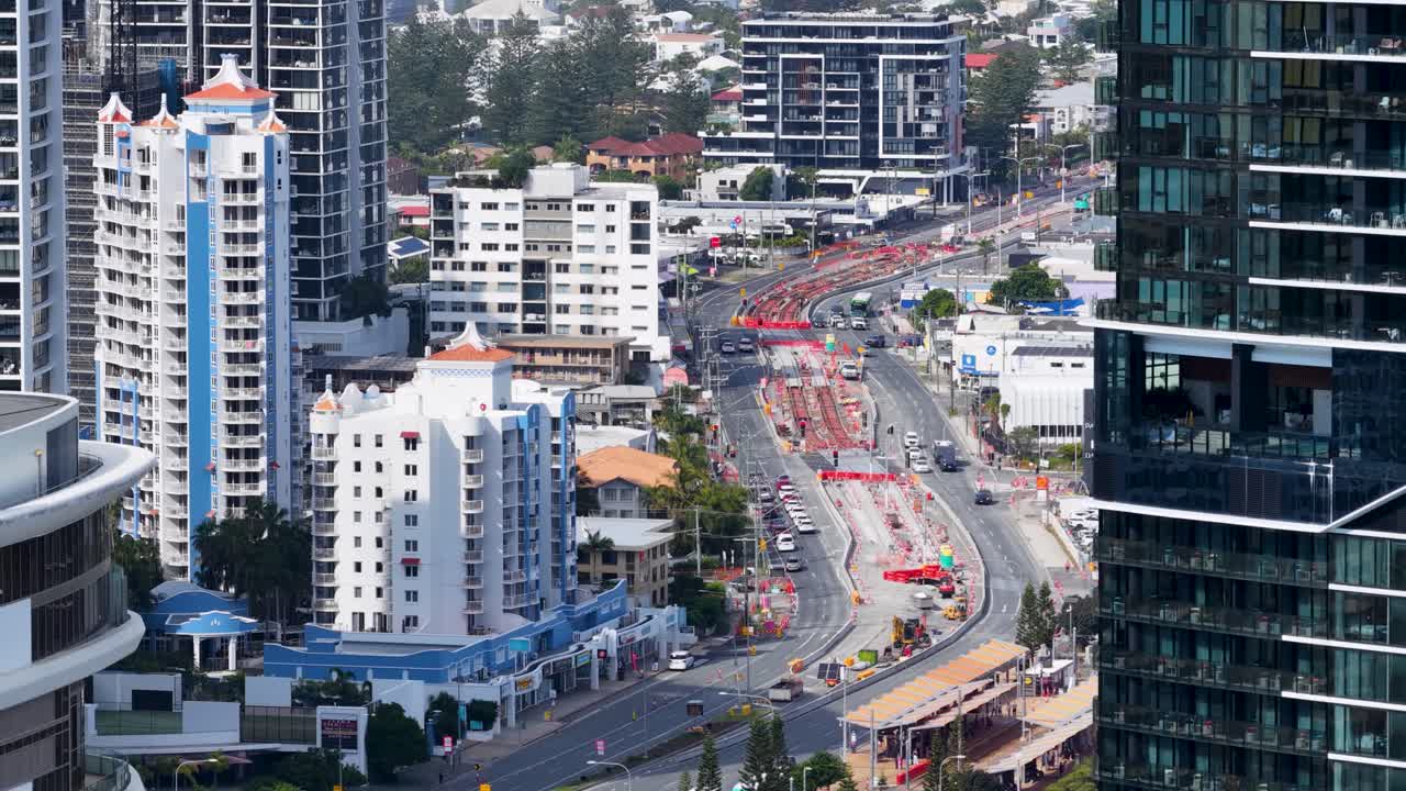 Aerial view of construction and traffic on a busy urban highway near Pacific Fair Shopping Center, Broadbeach, Australia