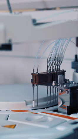 modern medical equipment is working in the laboratory room at hospital. work process of automated machine, blood and urine sample analysis in medical clinic. vertical video