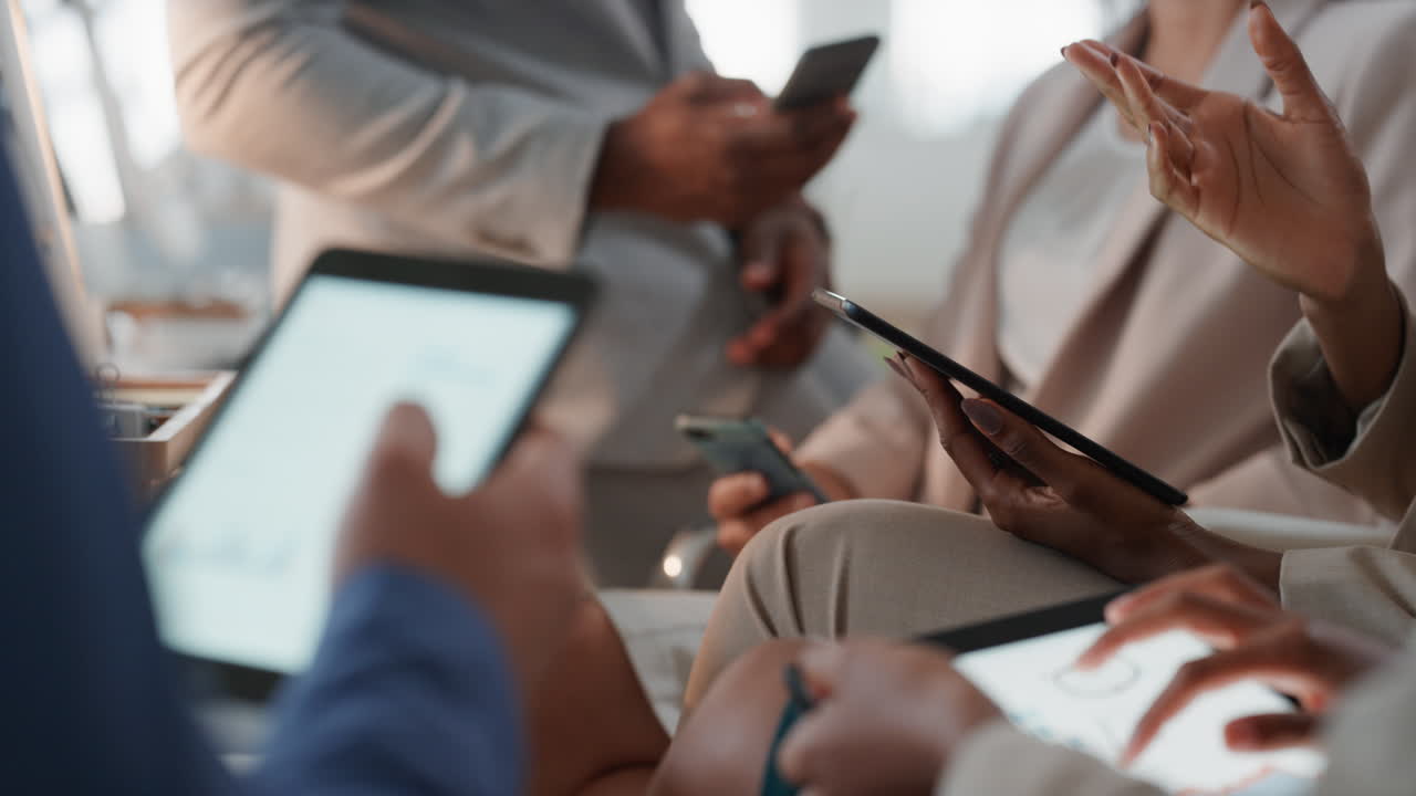 diverse business people using digital tablet computers browsing financial graph information on screen colleagues brainstorming ideas in office meeting