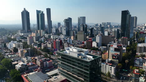 Mexico-City-Aerial-Drone-at-Magic-Hour,-Skyline-tracking-backward