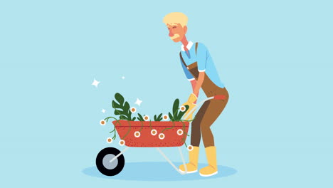 jardinero empujando una carretilla llena de flores