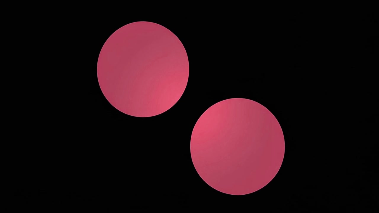 Two Pink Circles Moving and Merging on Black Background