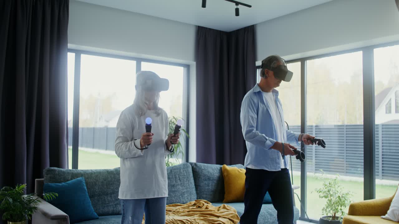 Couple playing virtual reality games at home