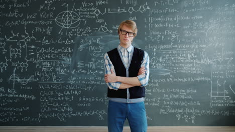 man in front of a chalkboard full of math equations