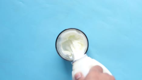 pouring milk into a glass