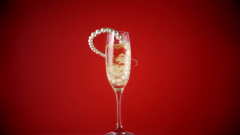 String-of-pearls-falling-into-champagne-flute