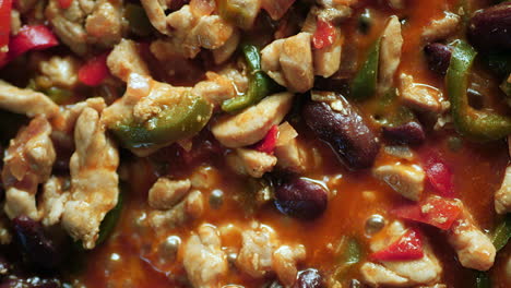 fajita mix simmering on a skillet - vertical orientation