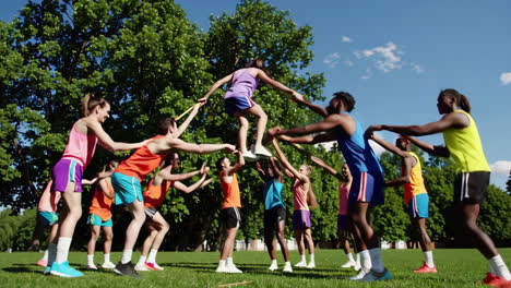 diverse group playing games in a park