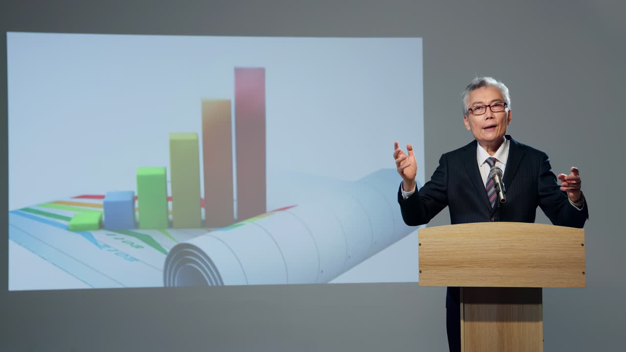 Financial consultant, Business Forum Economics Conference Stage: Senior Speaker Concludes His Report with a Speech and Showing Infographics, Statistics on the Big Screen.