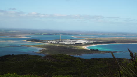 Zoom-in-to-Tiwai-Point-Aluminium-Smelter-as-seen-from-the-top-of-Bluff-Hill-in-New-Zealand