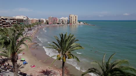 Torrevieja-beach,-drone-lands.-Alicante,-Costa-Blanca,-Spain