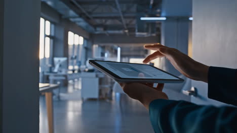 Person Using Tablet in a Modern Office Environment