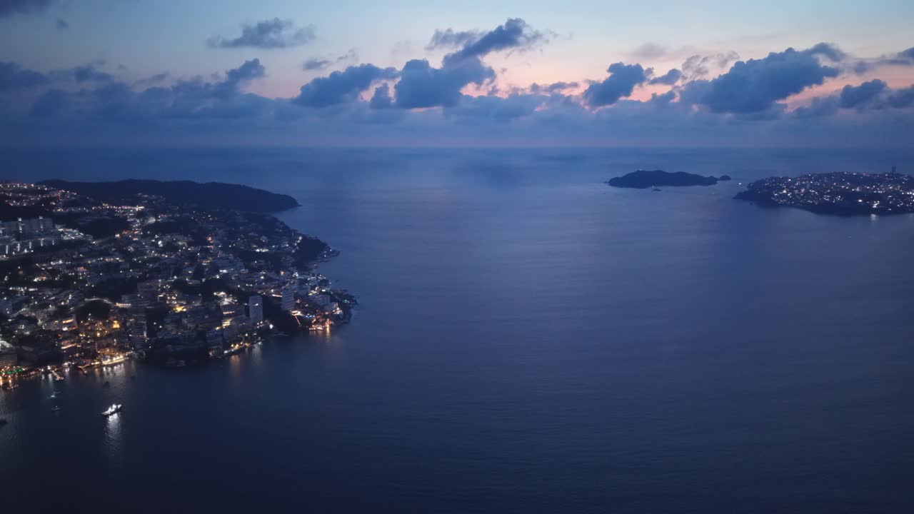 Drone footage over Acapulco Bay at sunset, Mexico