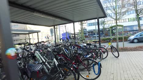 fast camera movement behind parked bycicles in germany