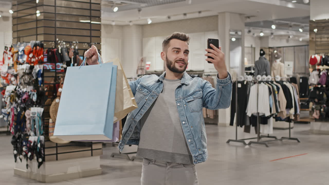 Man Video Calling At Clothing Store