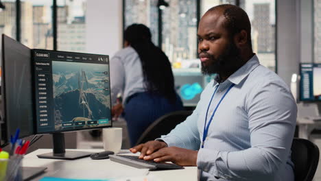 engineer in office works on power lines pole cad design for improved technology