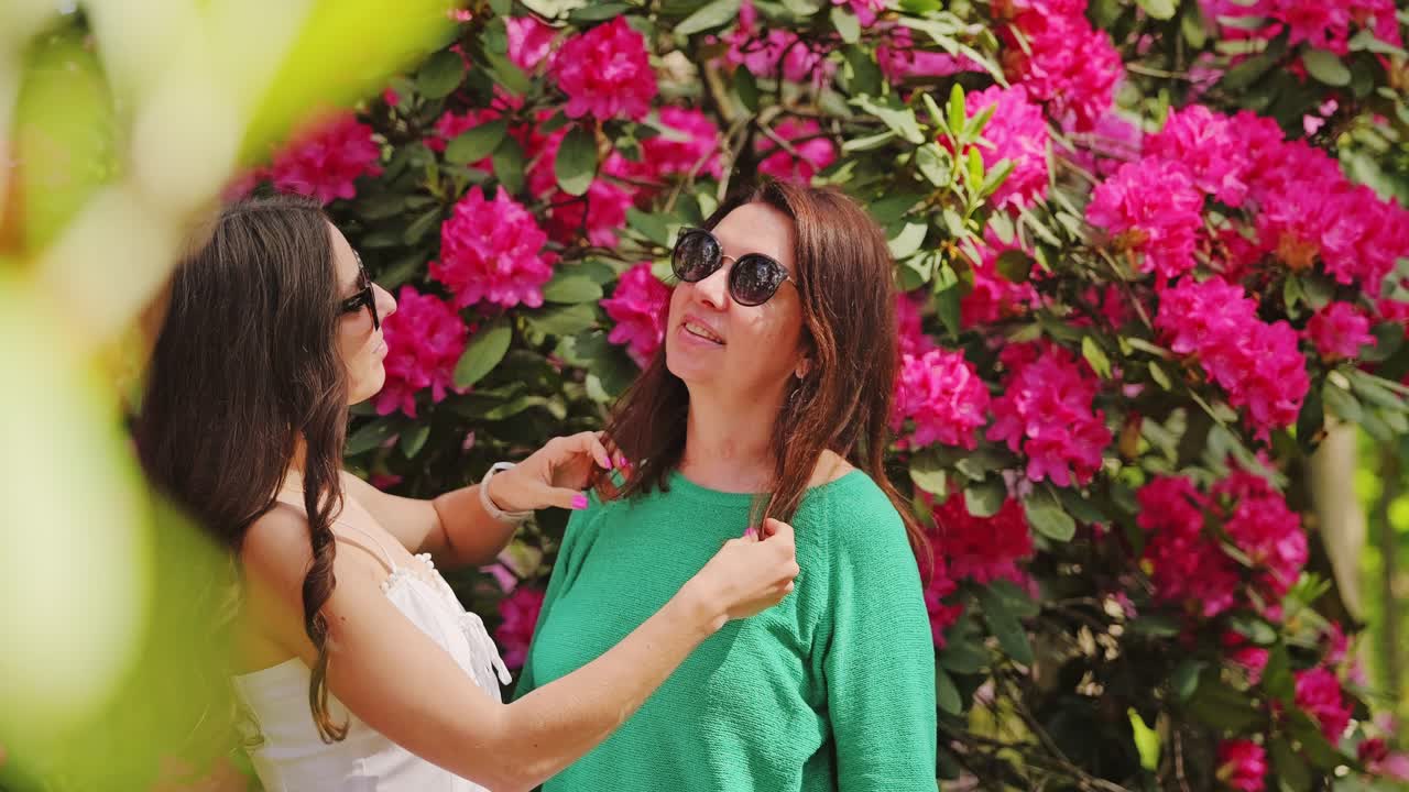 Tender Daughter And Mother Moment In Blooming Rhododendron Park Slow Motion