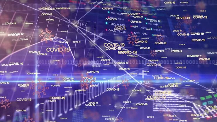Animation of words Covid-19 drawing floating over a stock market display.