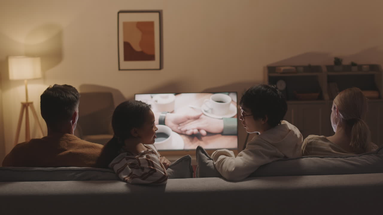 Man and Woman Talking on Movie Night