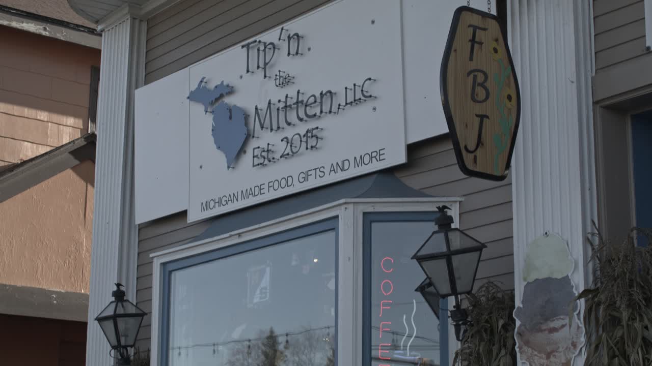 Tip' N Mitten store in downtown Grayling, Michigan with video tilting down