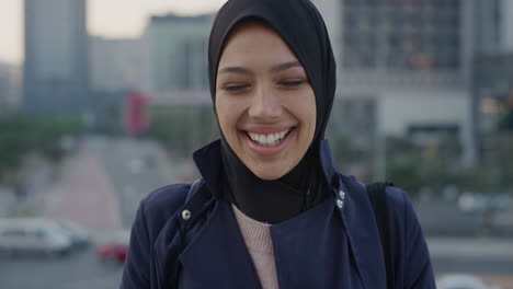 portrait happy young muslim business woman laughing enjoying professional urban lifestyle in busy city independent female wearing hijab headscarf slow motion