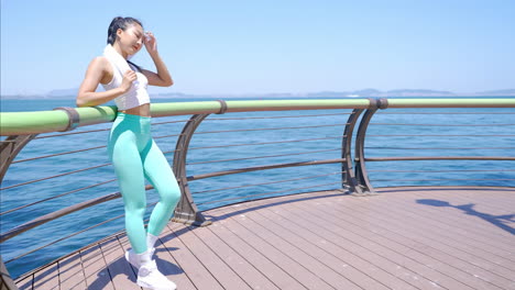 athletic sportswear female in activewear runner have break and rest after jogging workout, physical exercise outdoors