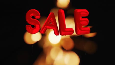 a red inflatable 'sale' text against a black background