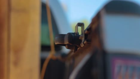 old man in the back of a truck getting ready to tie a securing rope before the delivery of constructed garden beds.