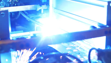 Process-welding-metal-part-on-automatic-machine-at-factory.-Metal-working
