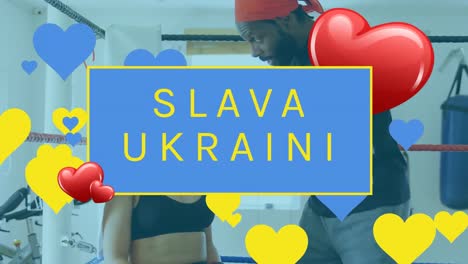 Animation-of-slava-ukraini-and-heart-floating-over-boxing-ring