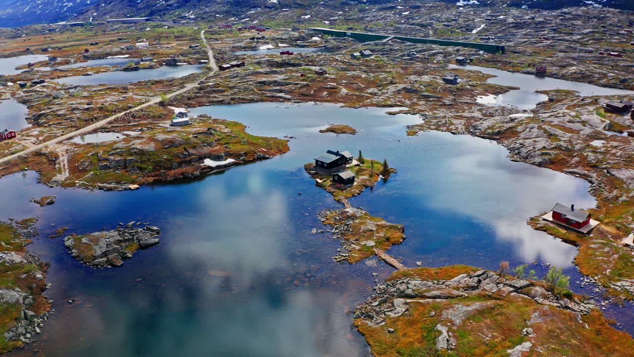 Aerial drone shot of the nordic rocky landscape of the town of Bjørnfjell at the Swedish border.
High view of the arctic tundra and vast wilderness.
