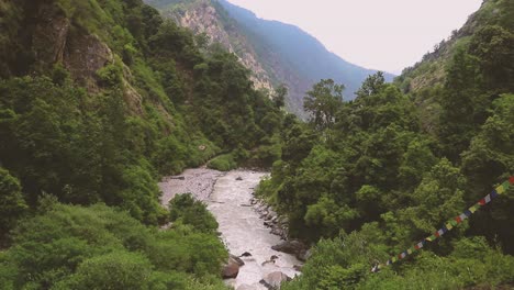 river from langtang trek surrounded by mountains in nepal