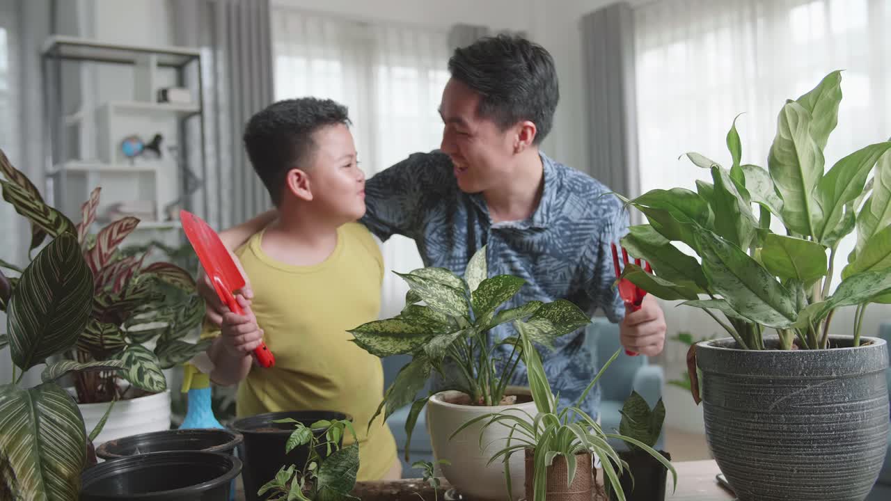 Father and son gardening at home