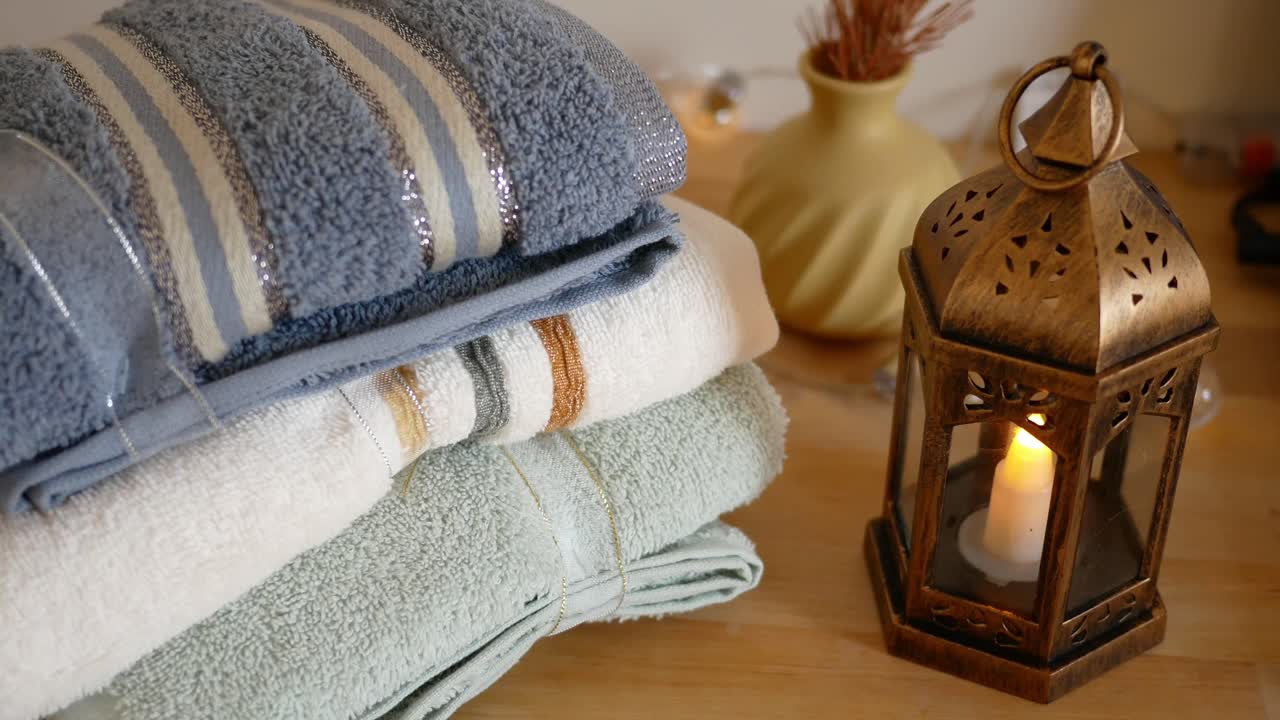Stacked Towels with Lantern
