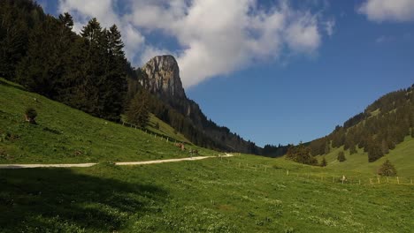 aerial, drone shot backpacking trekking alone on mountain valley