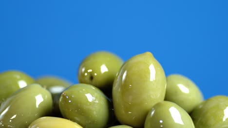 a pile of olives rotates slowly.