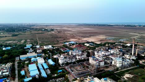 drone view of an active chemical manufacturing plant in chennai. its dense cluster of processing units and structures highlights complex industrial operations and technological advancement