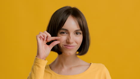 woman showing a small size gesture