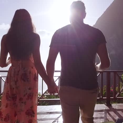 A-Romantic-Man-And-Woman-Couple-On-Vacation-Toasting-Drink-On-The-Balcony-Of-A-Luxury-Resort-Hotel-Room-In-St-Lucia-Caribbean-Islands-3