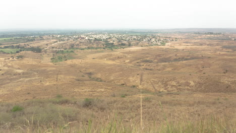 Angola,-Flying-over-a-small-adobe-village,-Caxito,-Bengo,-Africa-5