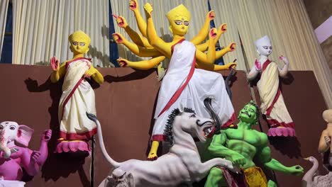 classic theme daker saj goddess durga idol with yellow color being prepared for durga puja festival in kolkata.
