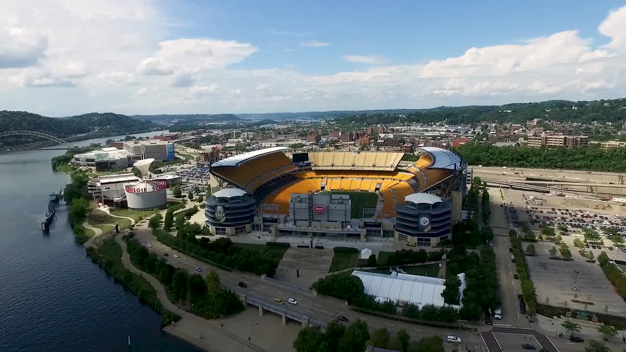 Aerial pan from Heinz field to north shore buildings of Pittsburgh Pennsylvania Concept: urban, cityscape, sporting, fields,  drone