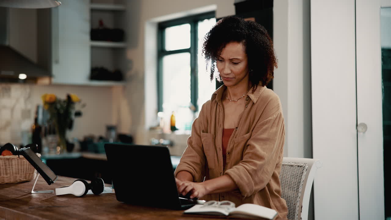 Woman working on her laptop at home