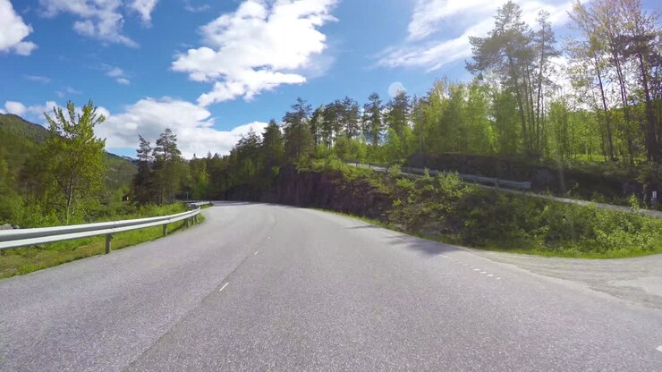 Driving a Car on a Road in Norway