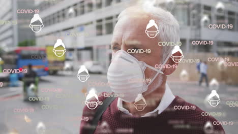 animation of covid 19 icons over senior man wearing face mask