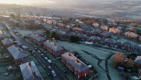 A-drone's-eye-view-captures-Dewsbury-Moore-Council-estate's-fame,-a-typical-UK-urban-council-owned-housing-development-with-red-brick-terraced-homes-and-the-industrial-Yorkshire