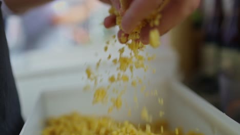 chef checks the couscous to see if it is ready