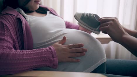 pregnant couple feels love and relax at home.