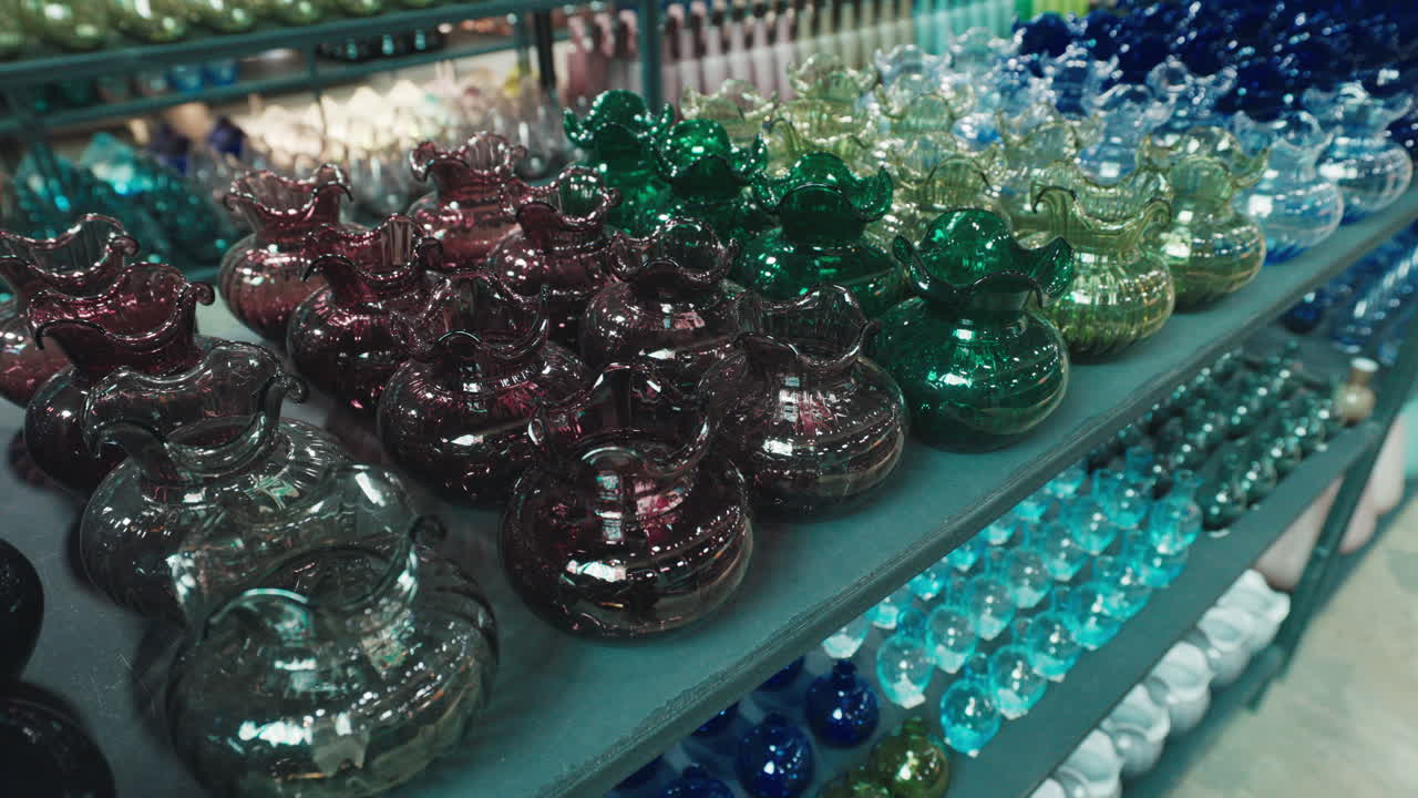 Colorful Glass Vases on Display Shelves